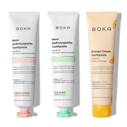 The n-Ha Toothpaste 3-Pack—Coco Ginger, Ela Mint & Kids Orange Cream—stands upright for oral care.