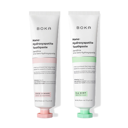 N-Ha Toothpaste 2-Pack—Coco Ginger and Ela Mint—to remineralize teeth on a black background.