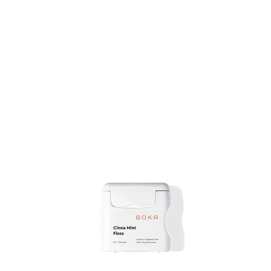Boka Floss - Cinna Mint with teflon-free natural vegetable wax on a white background and shadow.