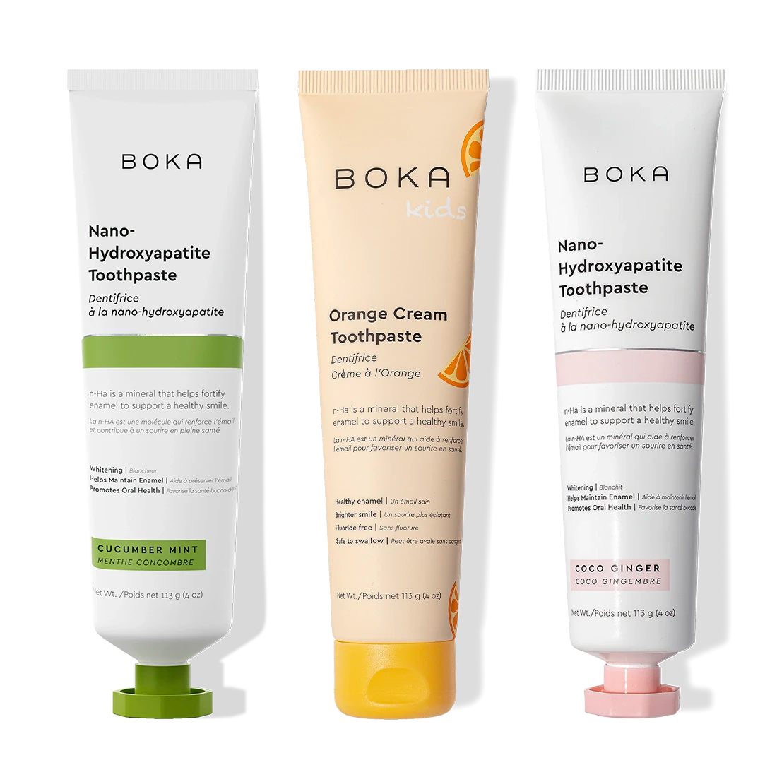 Three n-Ha Toothpaste 3-Pack tubes in tasty flavors stand upright on display for oral care.
