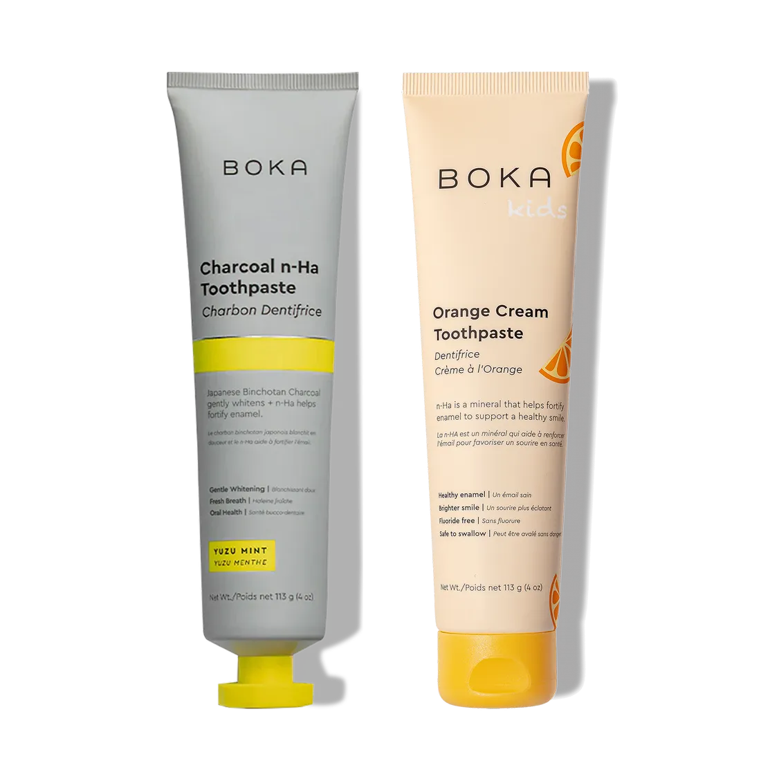 Two n-Ha Toothpaste 2-Packs, with nano-hydroxyapatite for enamel, stand side by side.