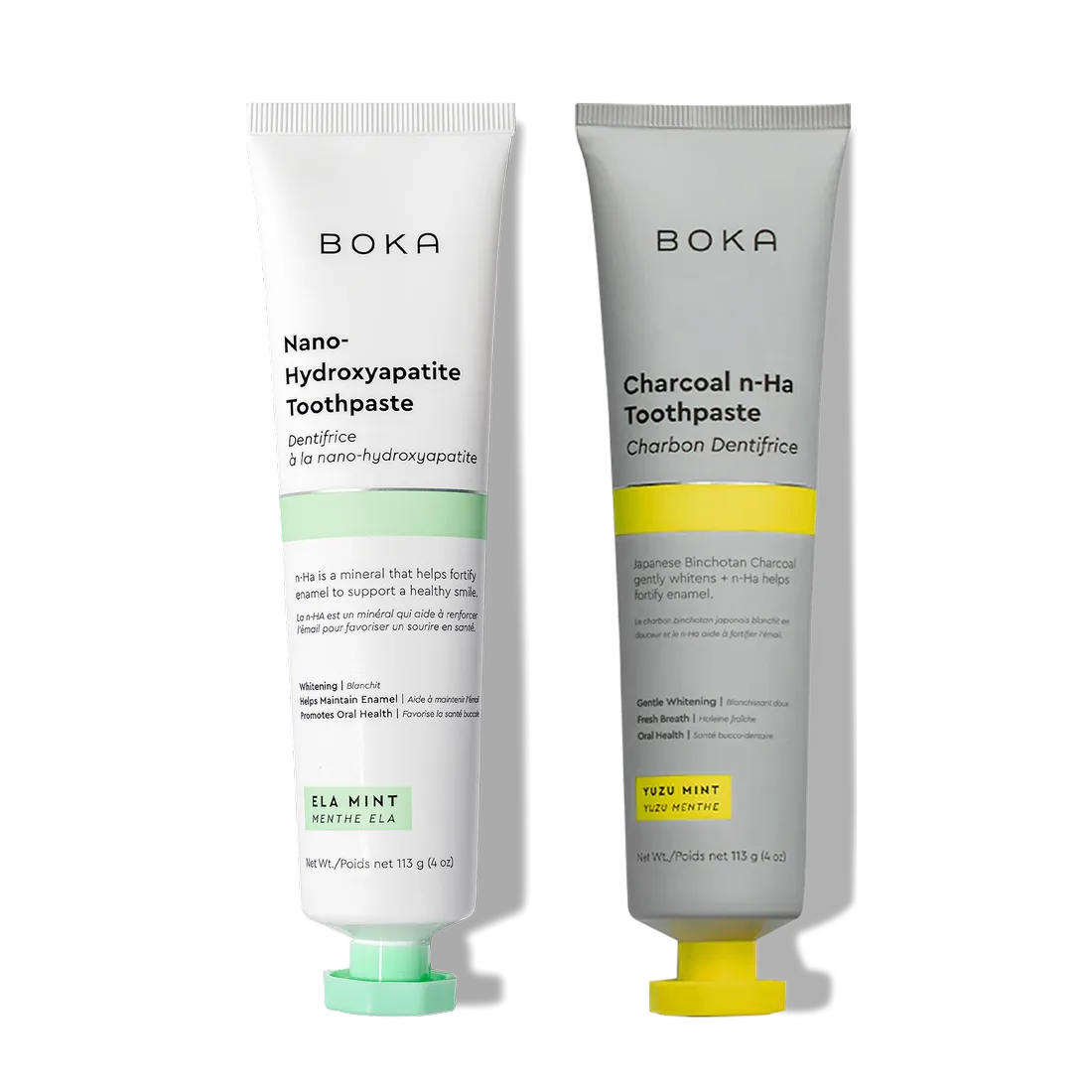 Two n-Ha Toothpaste 2-Pack tubes stand upright, formulated to remineralize teeth and strengthen enamel.