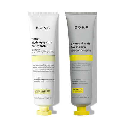 N-Ha Toothpaste 2-Pack: Charcoal & Nano-Hydroxyapatite, both to fortify enamel, with yellow caps.