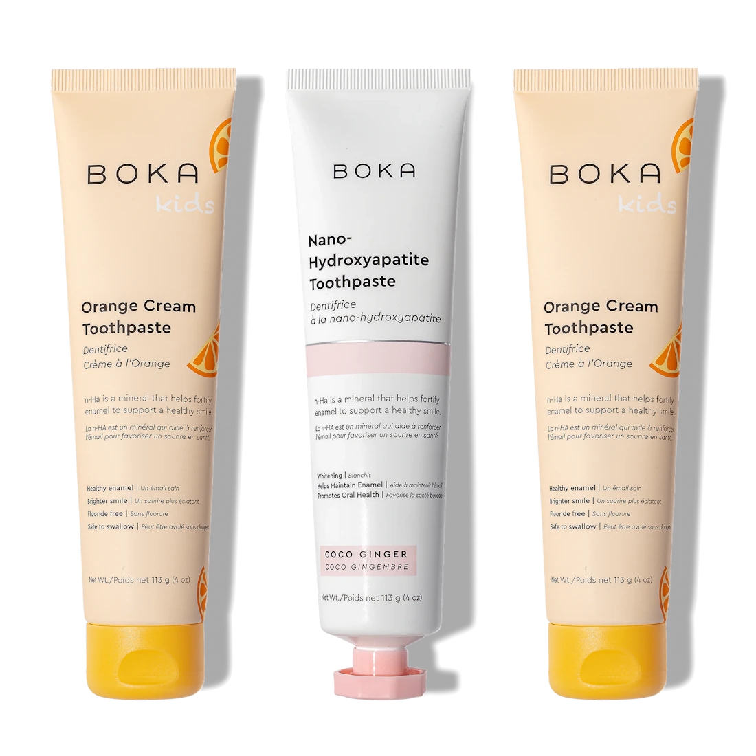 Three n-Ha Toothpaste 3-Pack tubes in Orange Cream & Coco Ginger stand upright on white.